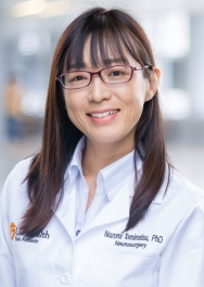 Nozomi Tomimatsu, PhD, smiles for profile photo.